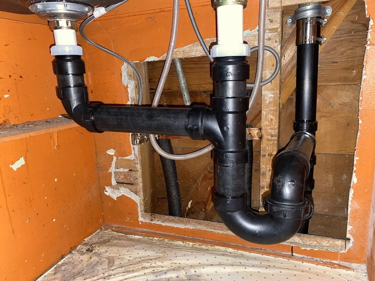 Professional Garbage Disposal Repair equipment and tools on the job in Beaver
